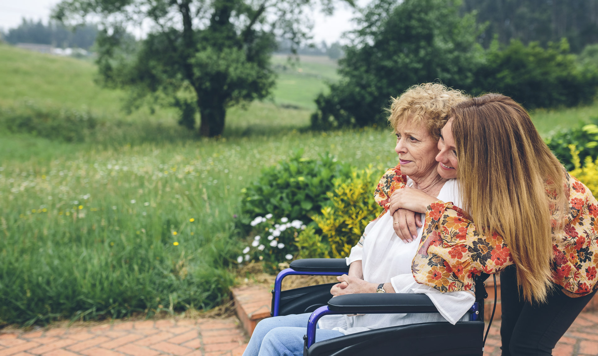 Caregiver and client walking outdoors
