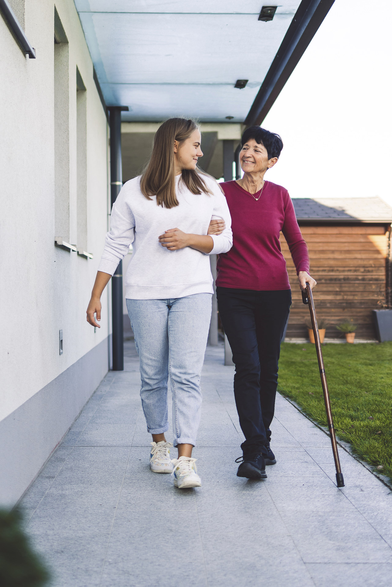 Senior woman smiling with a caregiver
