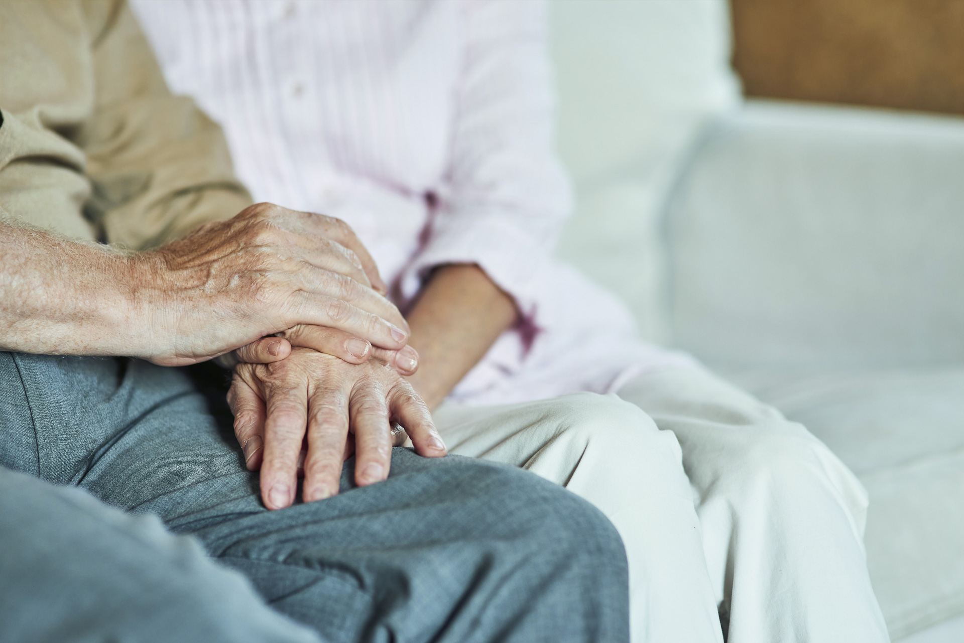 Older couple holding hands